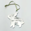 Pewter bunny rabbit Christmas ornament on green ribbon, engraved Calvin's First Christmas 2024.