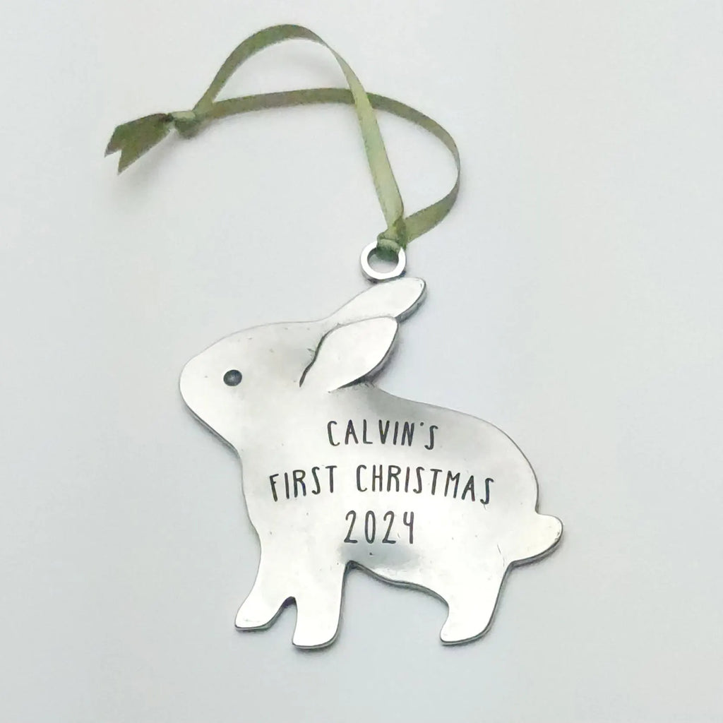 Pewter bunny rabbit Christmas ornament on green ribbon, engraved Calvin's First Christmas 2024.